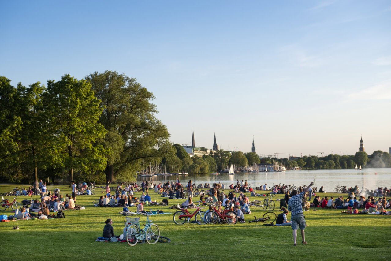 People relaxing at lake aussenalster